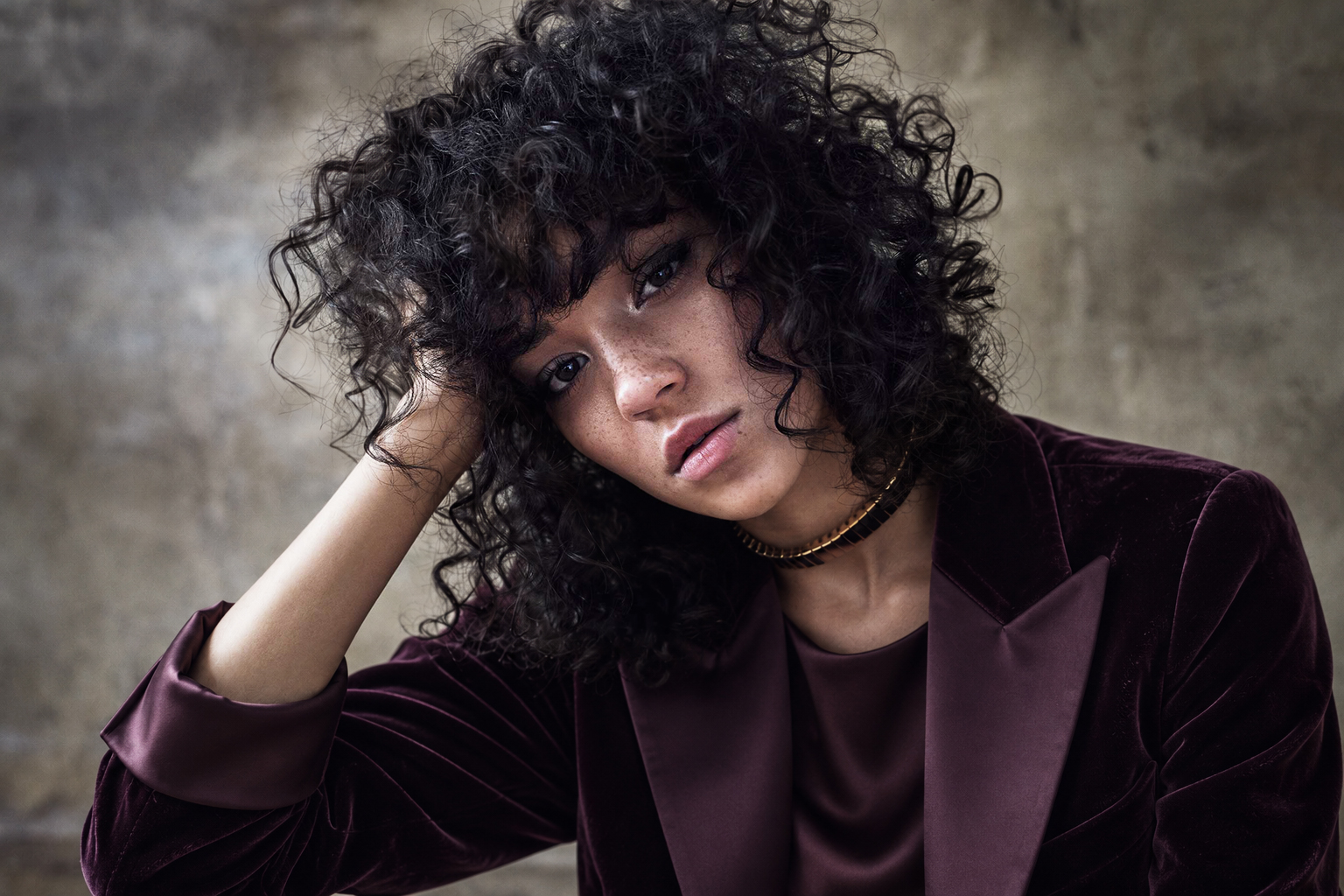 Horizontal portrait in a burgundy velvet jacket